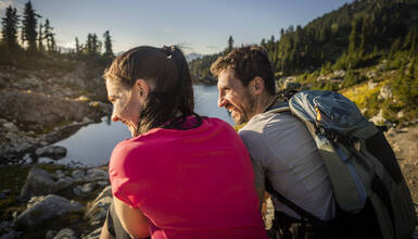 A couple of hikers taking a break on the Sproatt Trail Network in Whistler