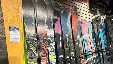 A row of skis inside FanatykCo ski shop in Whistler Village