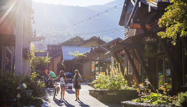 Two people shopping in Creekside Village in Whistler