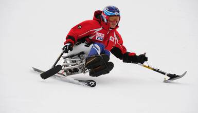 An adaptive athlete skiing in Whistler, British Columbia