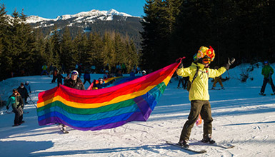 Festival goers skiing in the Pride Parade in Whistler