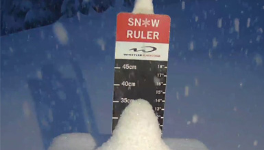 The snow ruler stacked with snow on Whistler Mountain